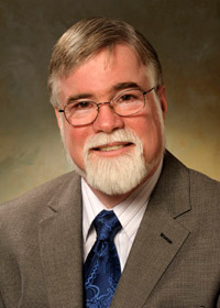 Portrait of Raymond S. Stillwell, President of Enlightec Ltd.